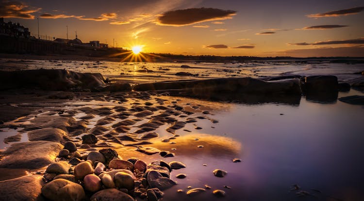 Unusual View Of Seashore At Low Tide At Sunset