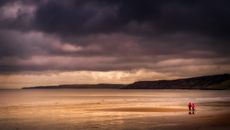 Body of Water Under Cloudy Sky