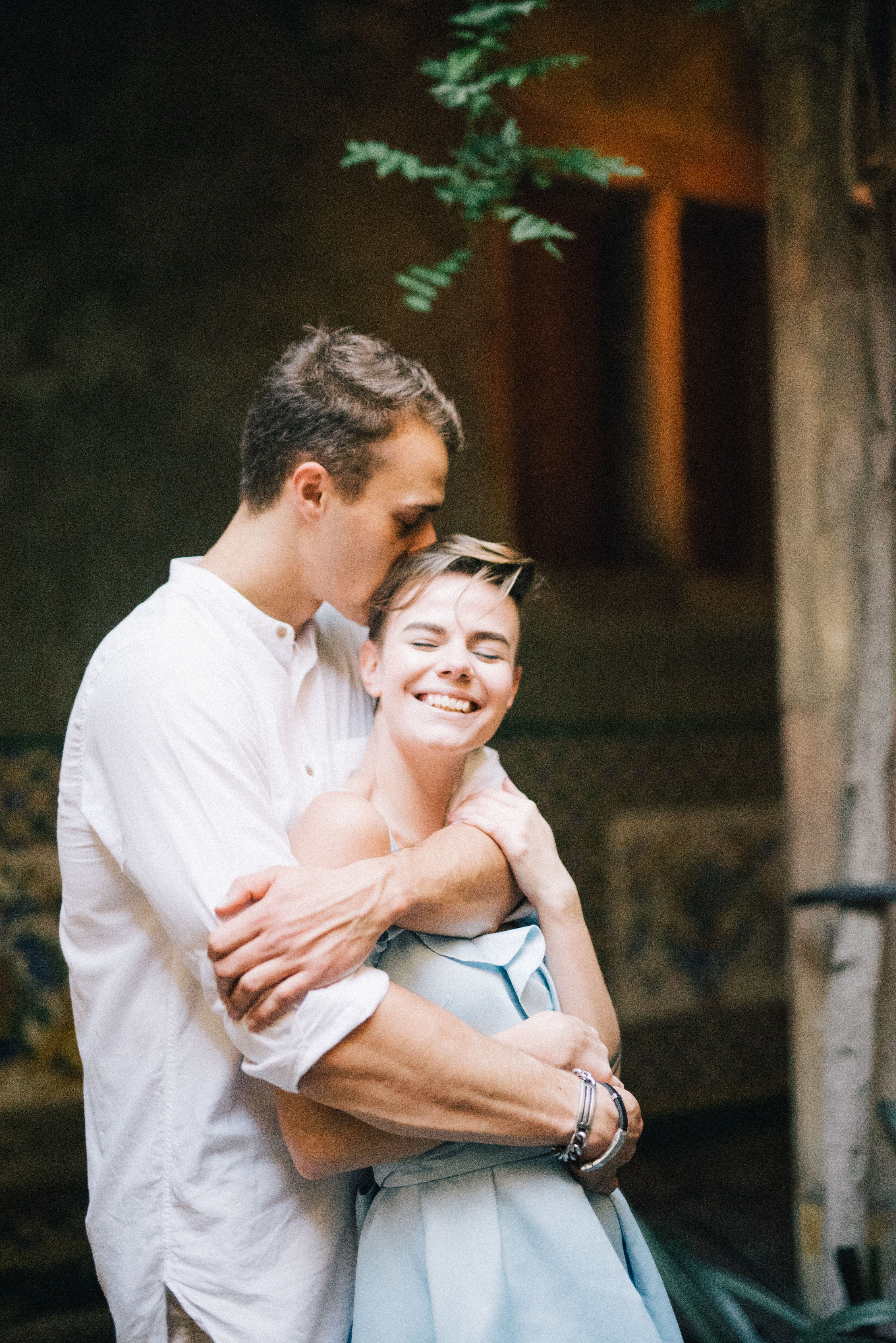 Man in White Dress Shirt Kissing Woman in Blue Dress · Free Stock Photo
