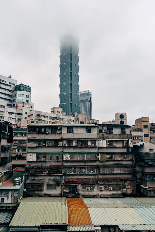 Old Residential Buildings and a Modern Skyscraper in the Distance