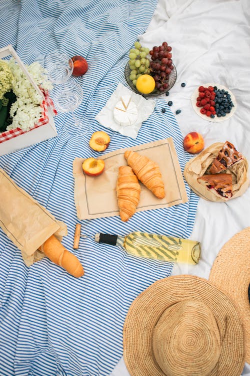 Food and White Wine on a Picnic Blanket