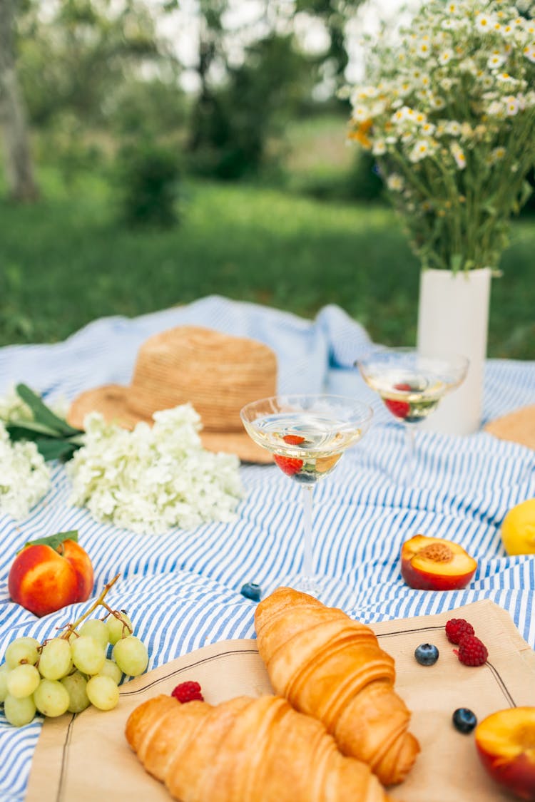 Food And Drinks On Picnic Blanket