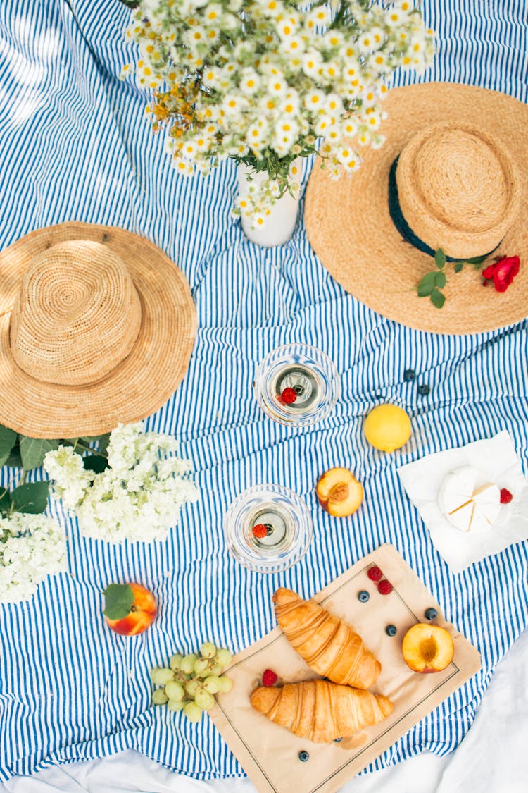 Flatlay Of Food And Drinks On Picnic Blanket
