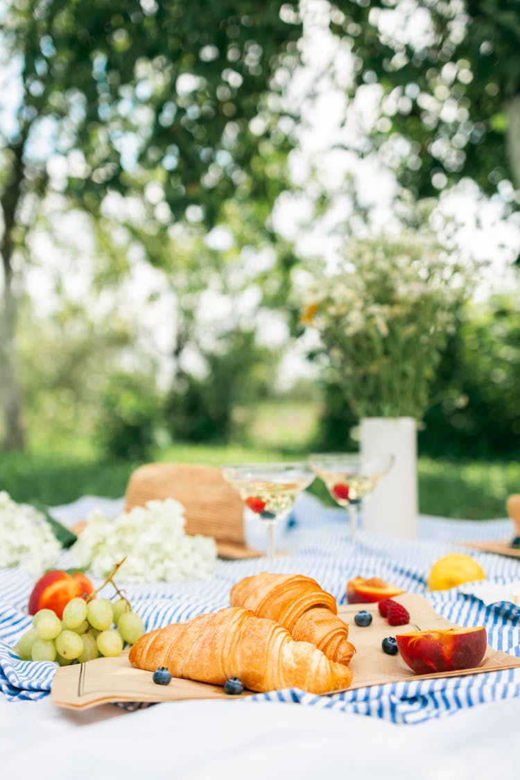 Food And Drinks On Picnic Blanket