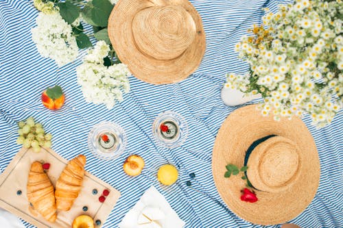 Brown Straw Hat on White Table Cloth