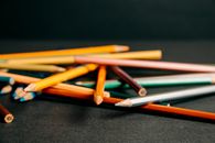 Colorful pencils lying on each other