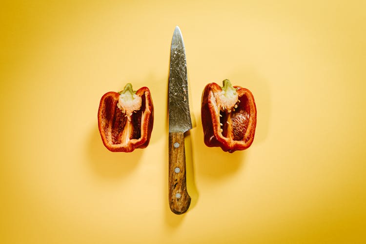 Cut Red Bell Pepper With Knife On Surface