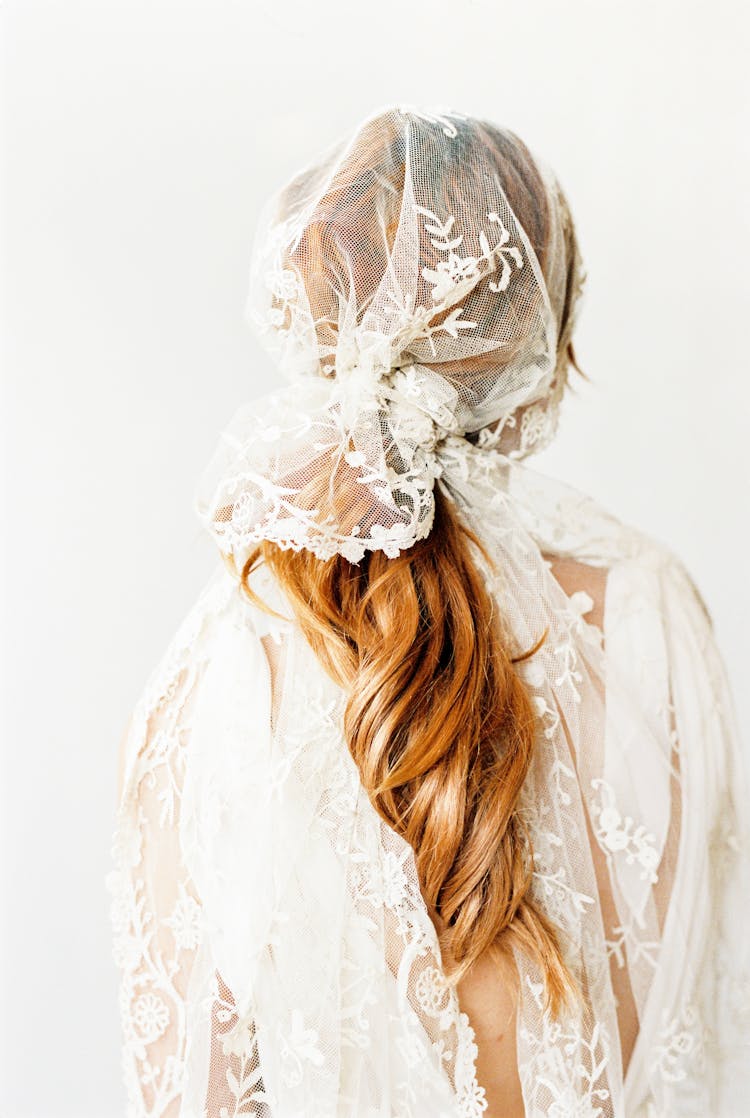 Woman In White Dress With White Veil