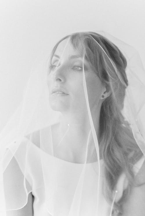Grayscale Photo of Woman Wearing Veil
