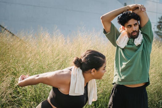 Man and woman stretching outdoors promoting a healthy lifestyle.