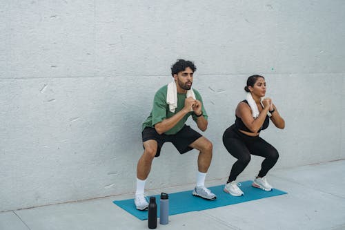 Man and Woman Exercising 