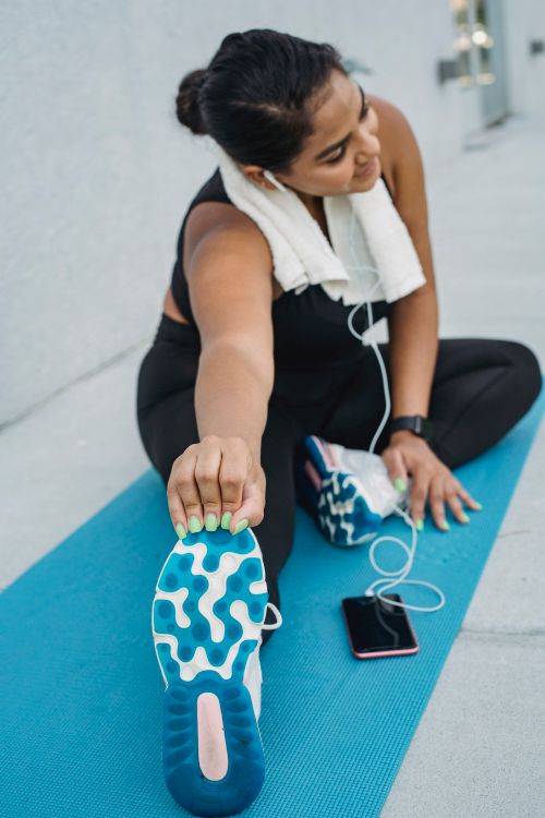 Woman exercising while listening to music