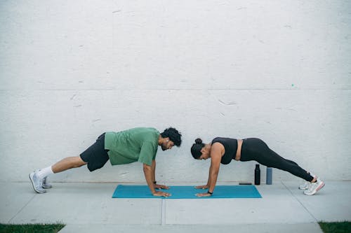 Man and Woman Exercising 