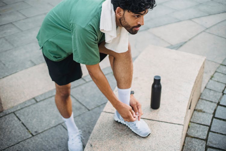 Man Tying Sneakers On Outdoor Workout