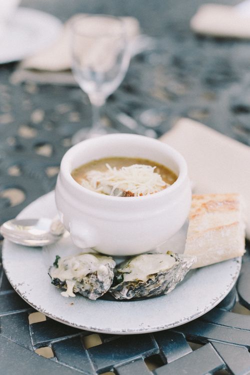 Free A delicious bowl of French onion soup with oysters and bread on a plate. Stock Photo