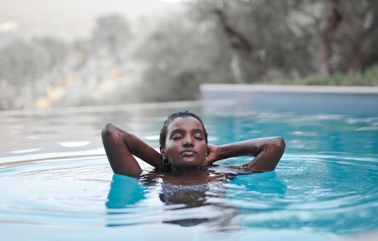 Young Woman Emerging From Water