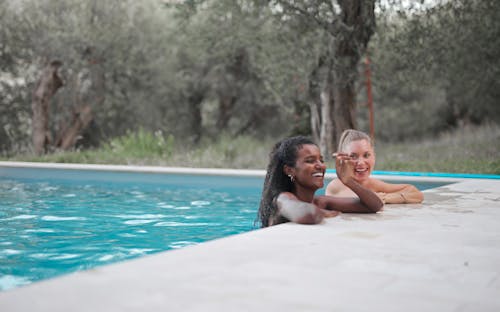 Women Having Fun in the Swimming Pool