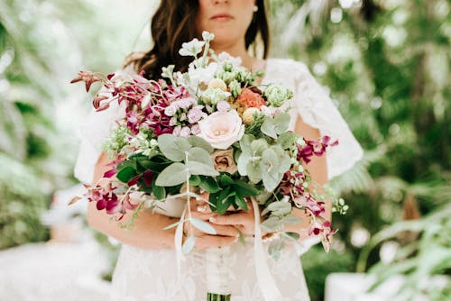 A Woman Holding a Bouquet of Flowers