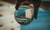 Person Holding Clear Glass Ball