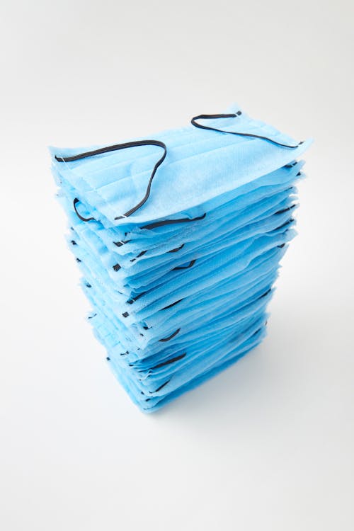 Free Stack of Blue Face Masks Stock Photo