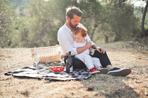 A Father Having a Picnic With His Child 