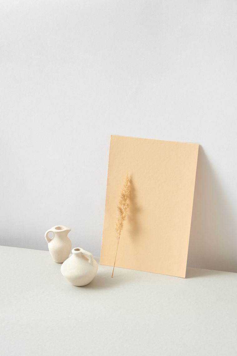 Pale ceramic vessels in a studio still life, photo by DS stories on Pexels