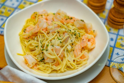 Close-up of a mouthwatering shrimp spaghetti pasta with herbs, perfect for a gourmet meal.