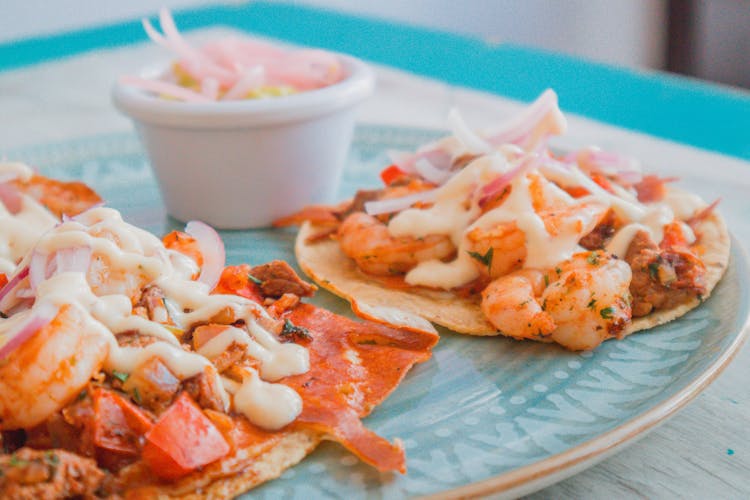 Close-up Shot Of Prawn Tacos On Ceramic Plate