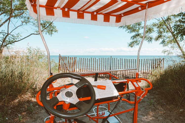 Modern Golf Cart Near Blue Sea