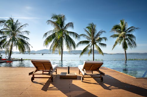 Loungers on pier of tropical resort