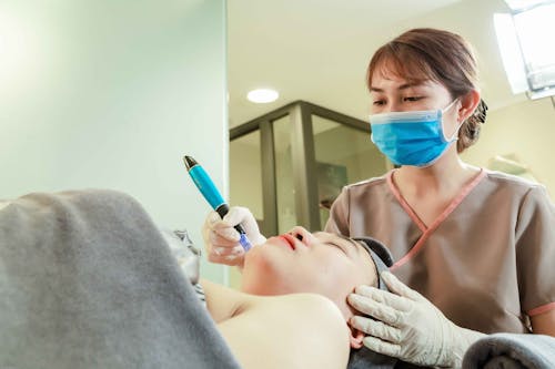 Free Woman Having Cosmetic Treatment in a Salon Stock Photo