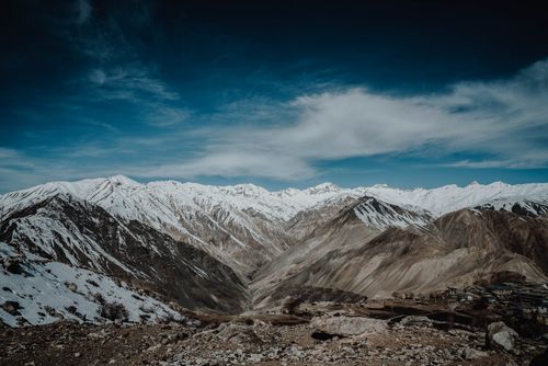 Free Stunning snowy mountain landscape under a dramatic sky captured outdoors. Stock Photo