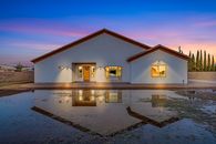 White and Brown Concrete House Under Blue Sky
