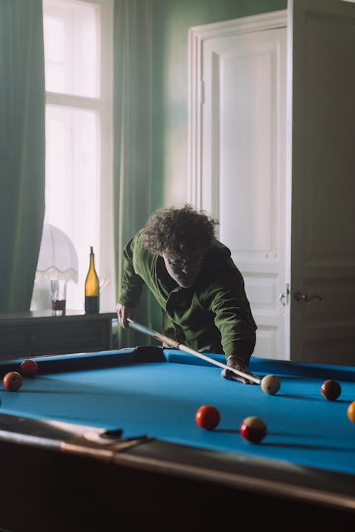 Free Man in Black Long Sleeve Shirt Playing Billiard Stock Photo