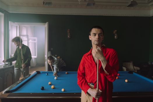 Man in Red Dress Shirt Playing Billiard