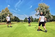 People on a Golf Course Green