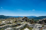 Mountains and Ancient Ruins with Tourists in Distance
