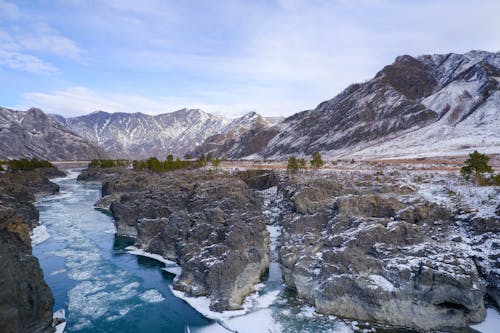 Icy River Among the Rocks in the Valley