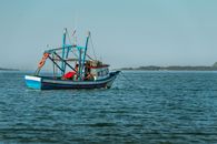Blue and Red Boat on Sea