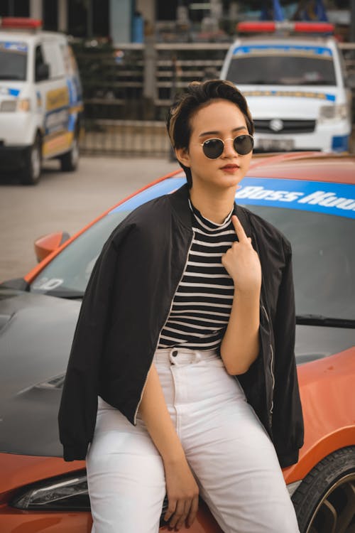 Free Portrait of a Woman with a Car Stock Photo