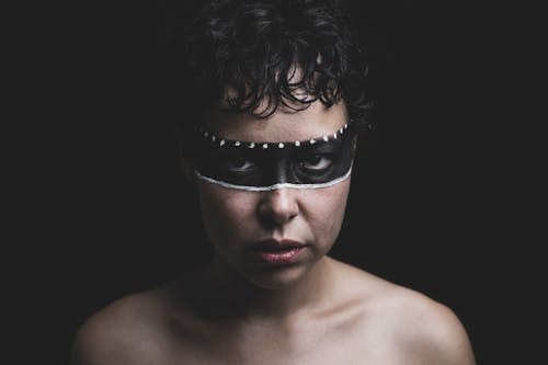 Free A Woman with Paint Mask Stock Photo