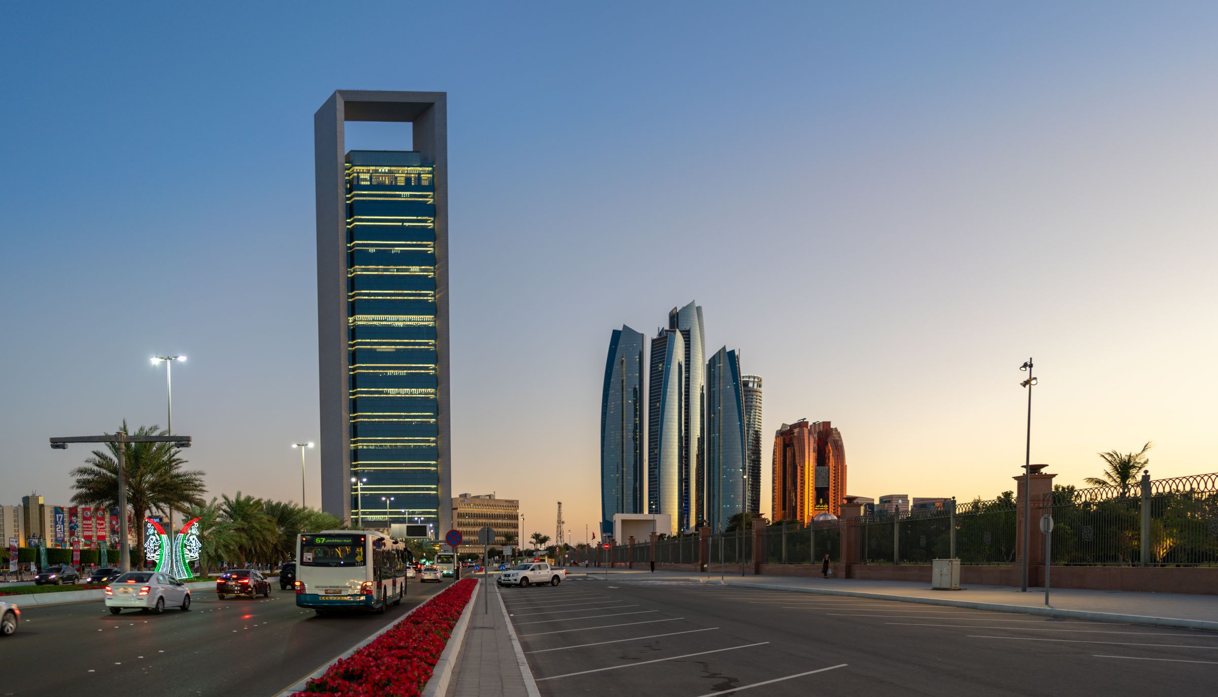 Abu Dhabi skyline and highway at sunset