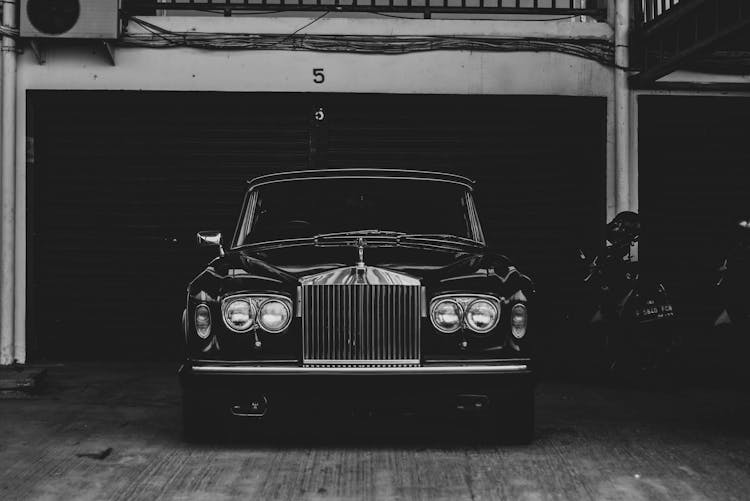 Grayscale Photo Of A Classic Rolls Royce