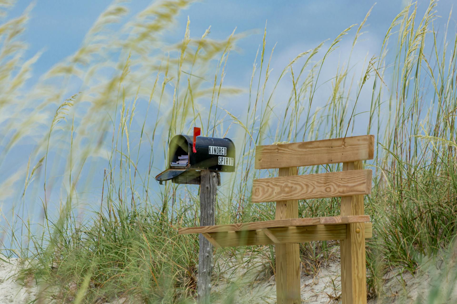 A Wooden Bench Near the Mailbox