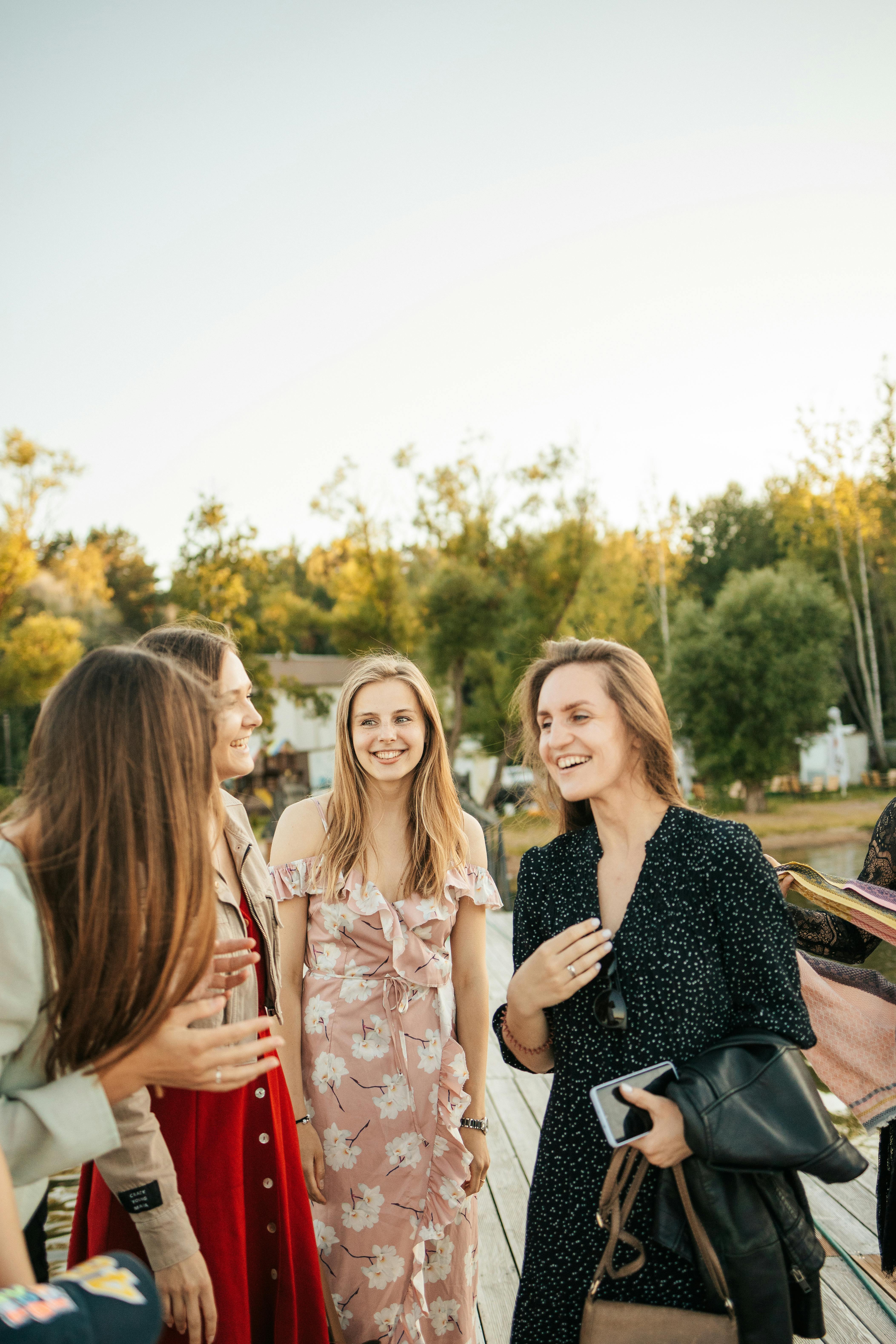 beautiful women laughing while having conversation