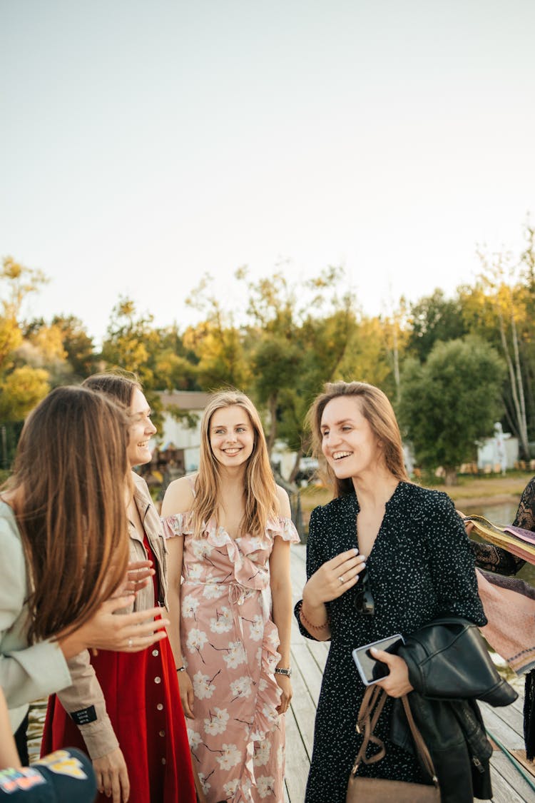 Beautiful Women Laughing While Having Conversation