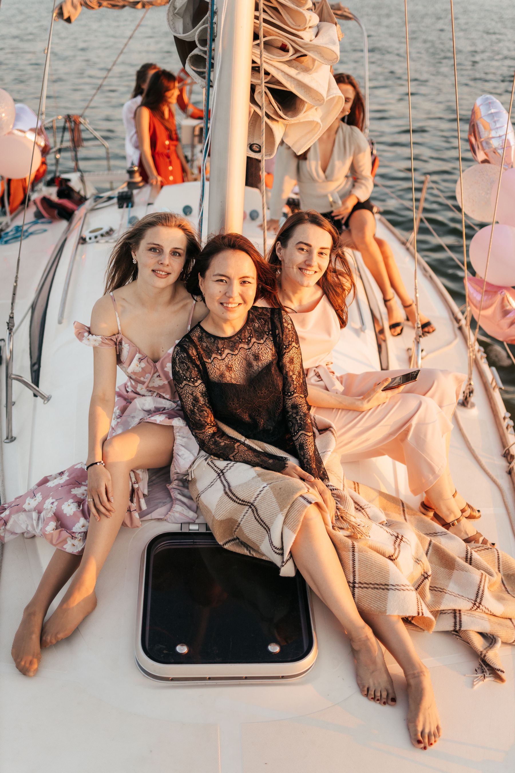 A relaxed boat-deck moment suggesting family and ease at sea