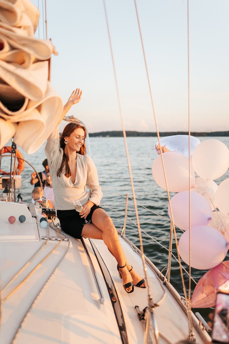 A Woman Sitting On The Yacht