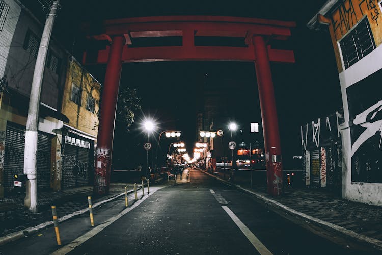 Straight Roadway Near Glowing Lights In Night City