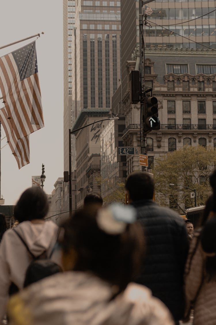 People Walking On Street Near City Buildings